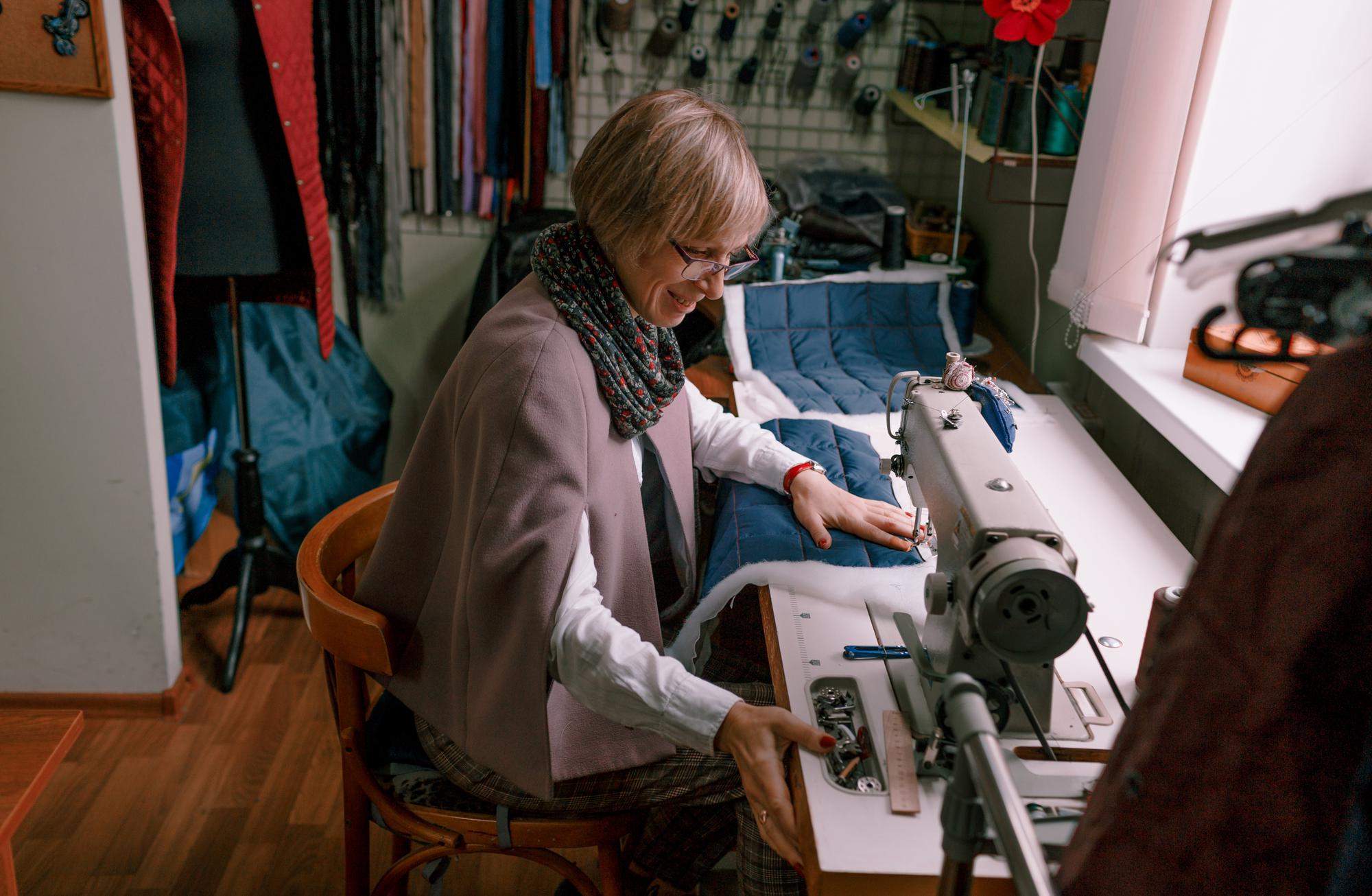 Embroidery machine and operator in workshop